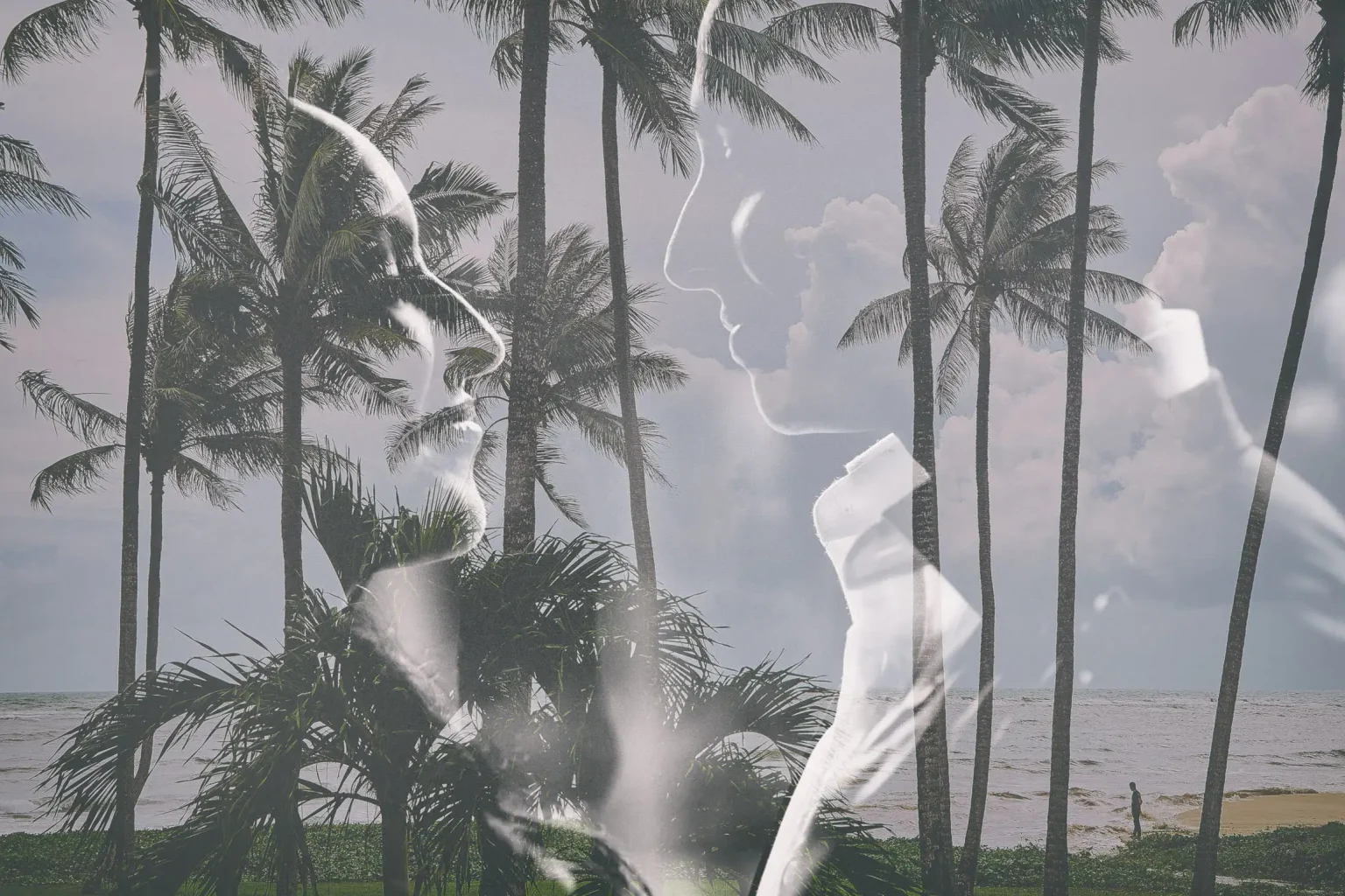 Black and white double exposure of Hina and Shamshir’s profiles over beachfront palm trees in Koh Samui